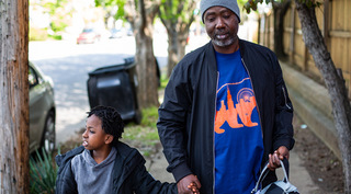 Trenton with son holding hands